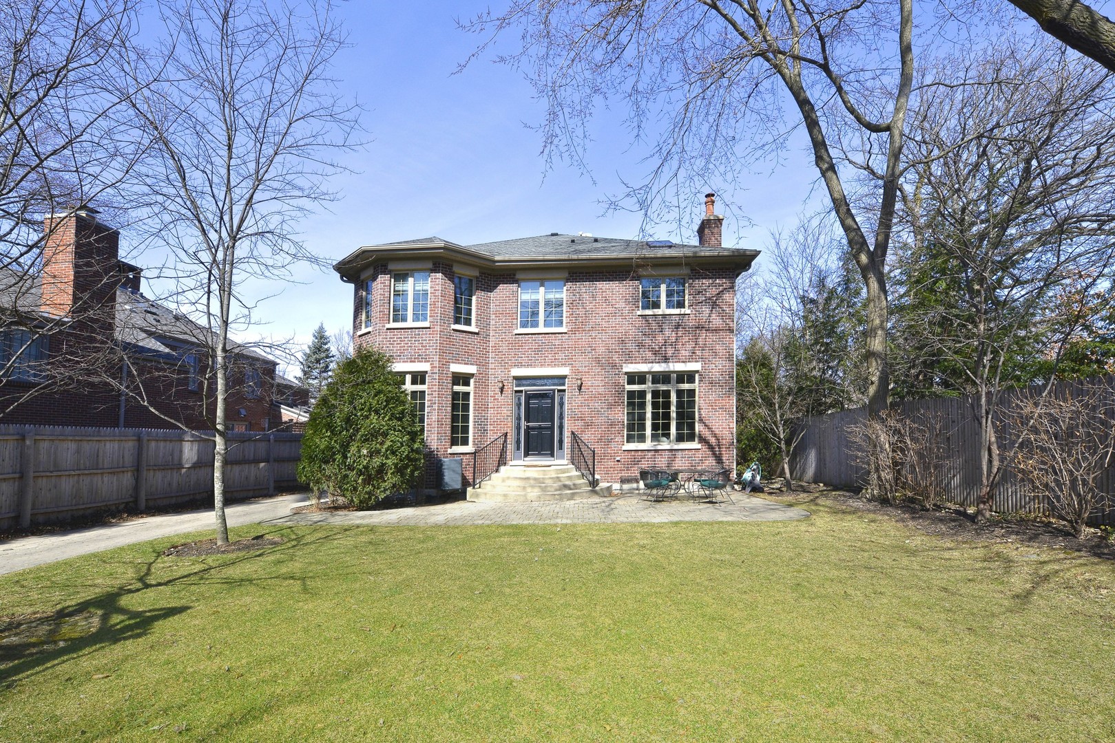 1000 Willow Road Winnetka, IL 60093 - Photo 23 of 26 a front view of a house with a yard