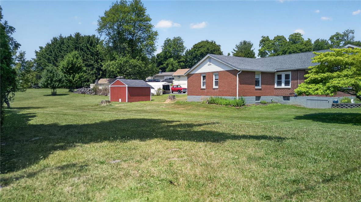 1166 Stones Crossing Road Easton, PA 18045 - Photo 18 of 35 A spacious backyard provides ample green space and a convenient storage shed.