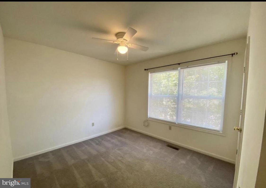 30 Acacia Place Dover, DE 19901 - Photo 3 of 5 a view of an empty room with a window