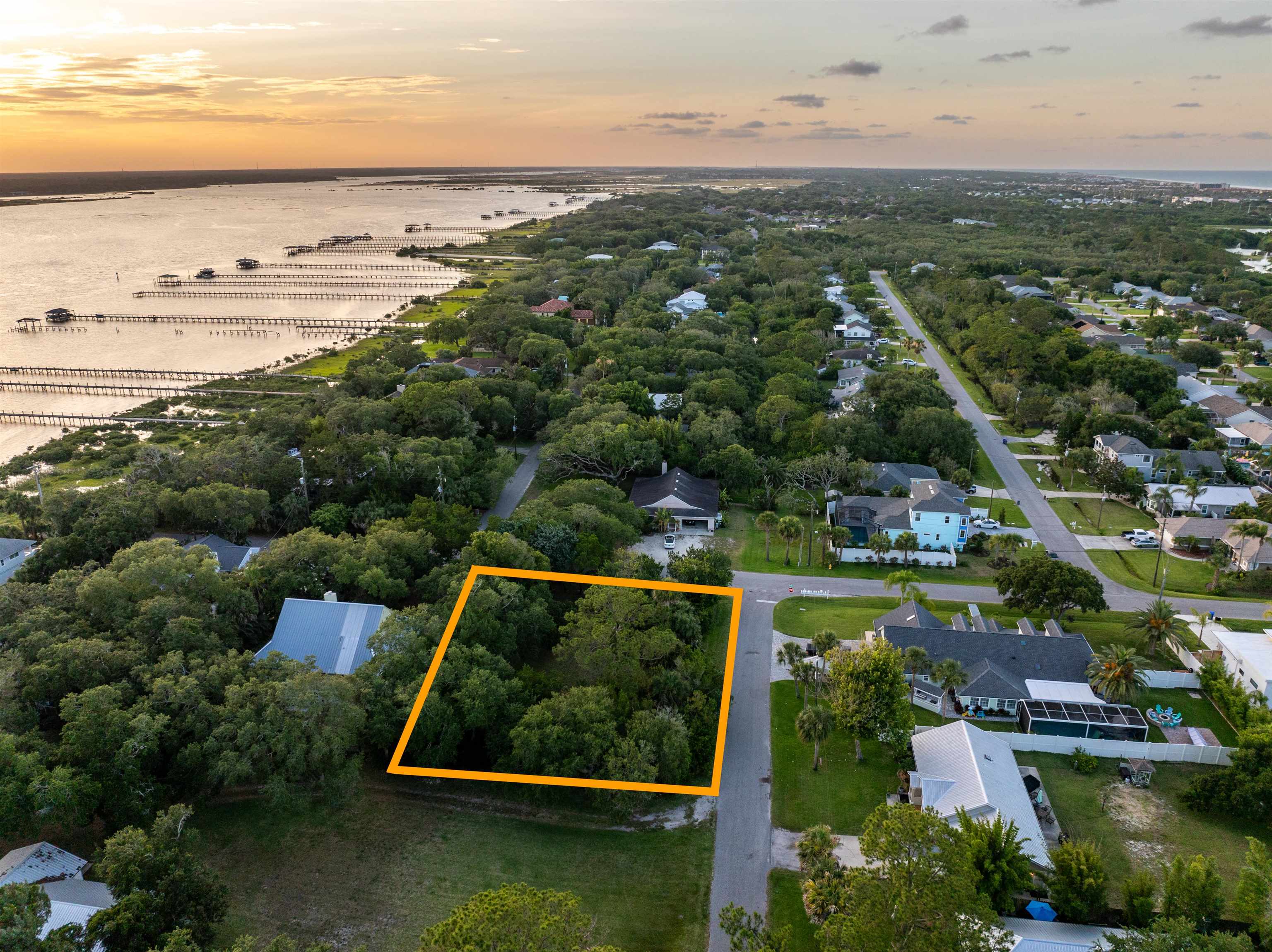 327 Micklers Road St. Augustine, FL 32080 - Photo 4 of 11 an aerial view of a city with lots of residential buildings ocean and mountain view in back