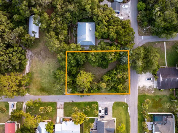 aerial view of a house with a yard