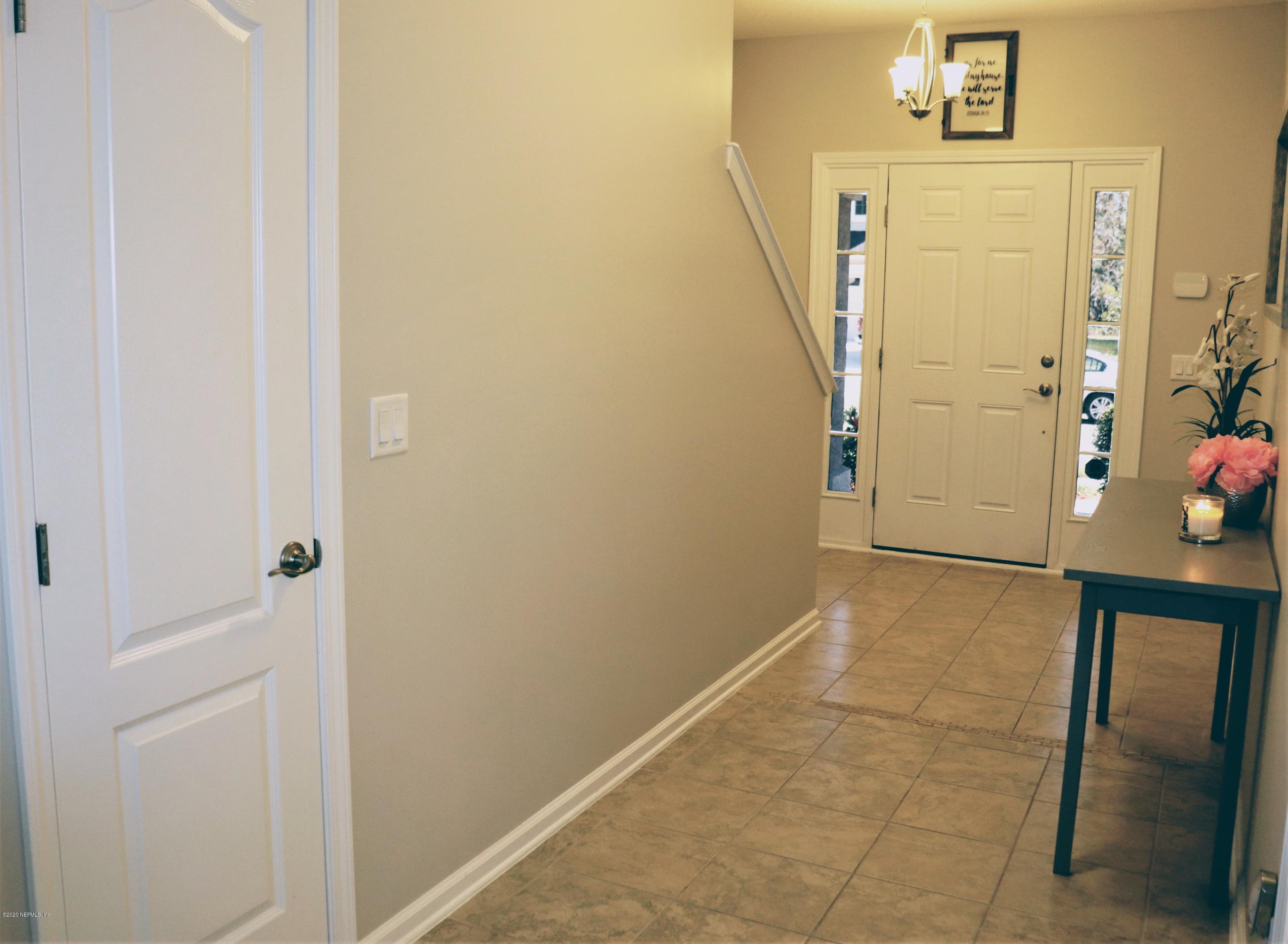 12294 Rouen Cove Drive Jacksonville, FL 32226 - Photo 11 of 41 a view of a hallway with front door