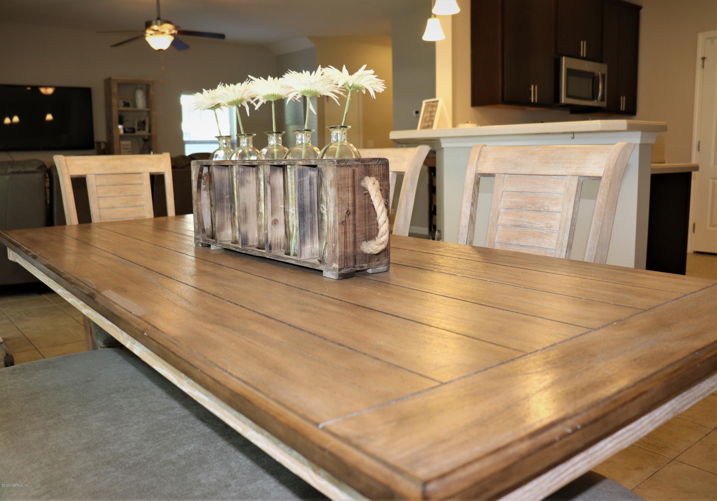 12294 Rouen Cove Drive Jacksonville, FL 32226 - Photo 17 of 41 a view of a living room with a fireplace