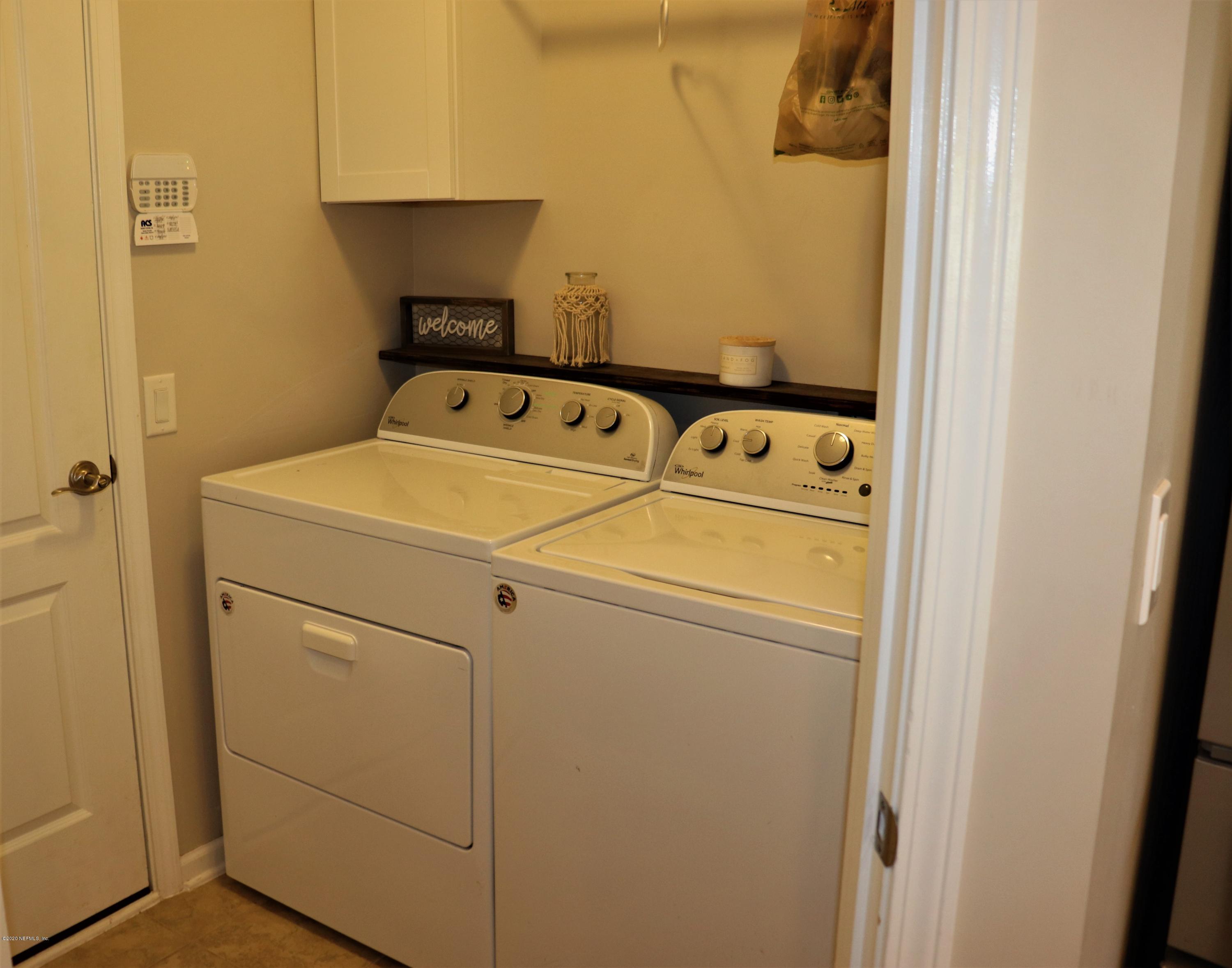 12294 Rouen Cove Drive Jacksonville, FL 32226 - Photo 21 of 41 a utility room with dryer and washer