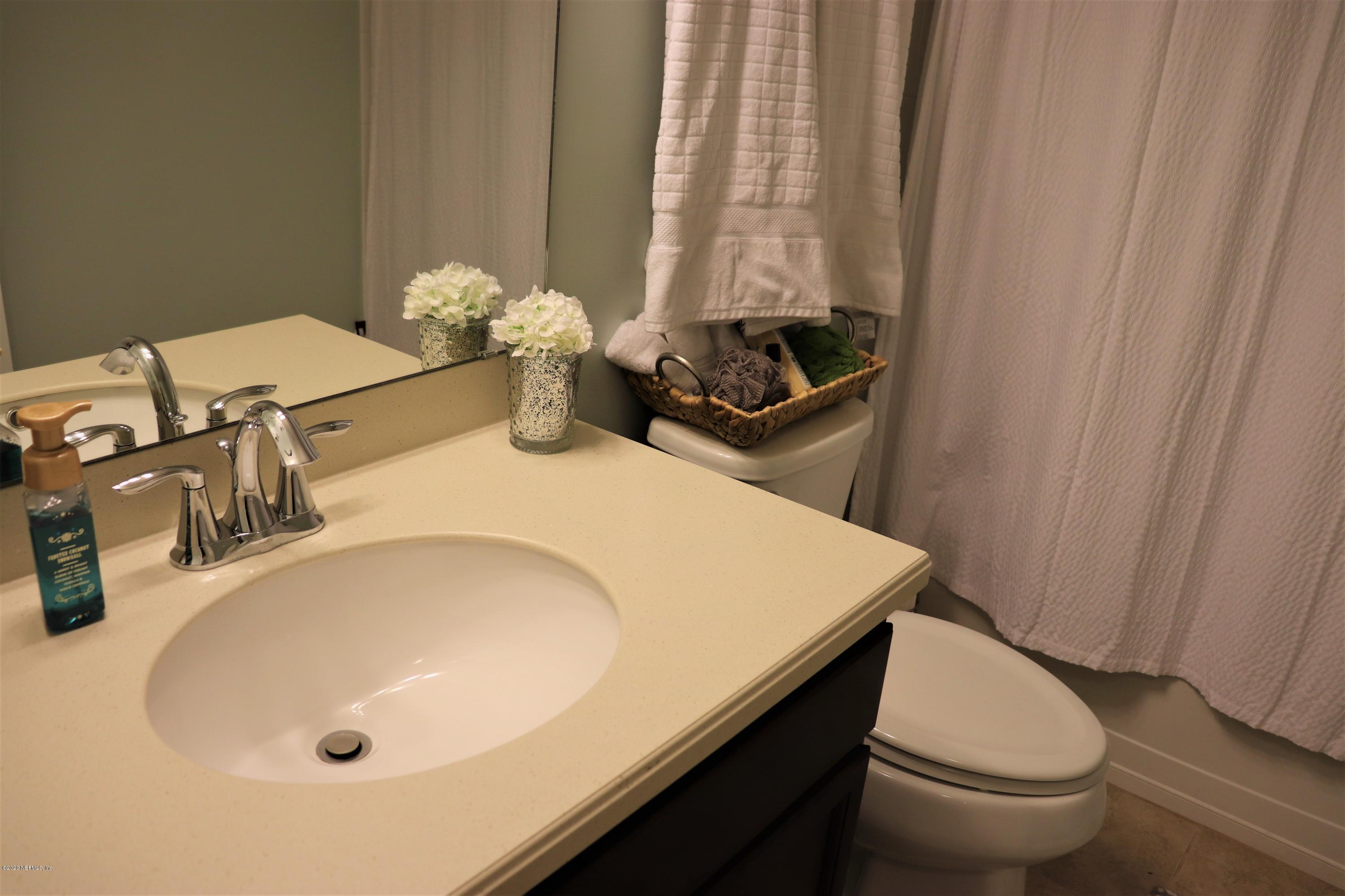 12294 Rouen Cove Drive Jacksonville, FL 32226 - Photo 31 of 41 a bathroom with a sink and a toilet
