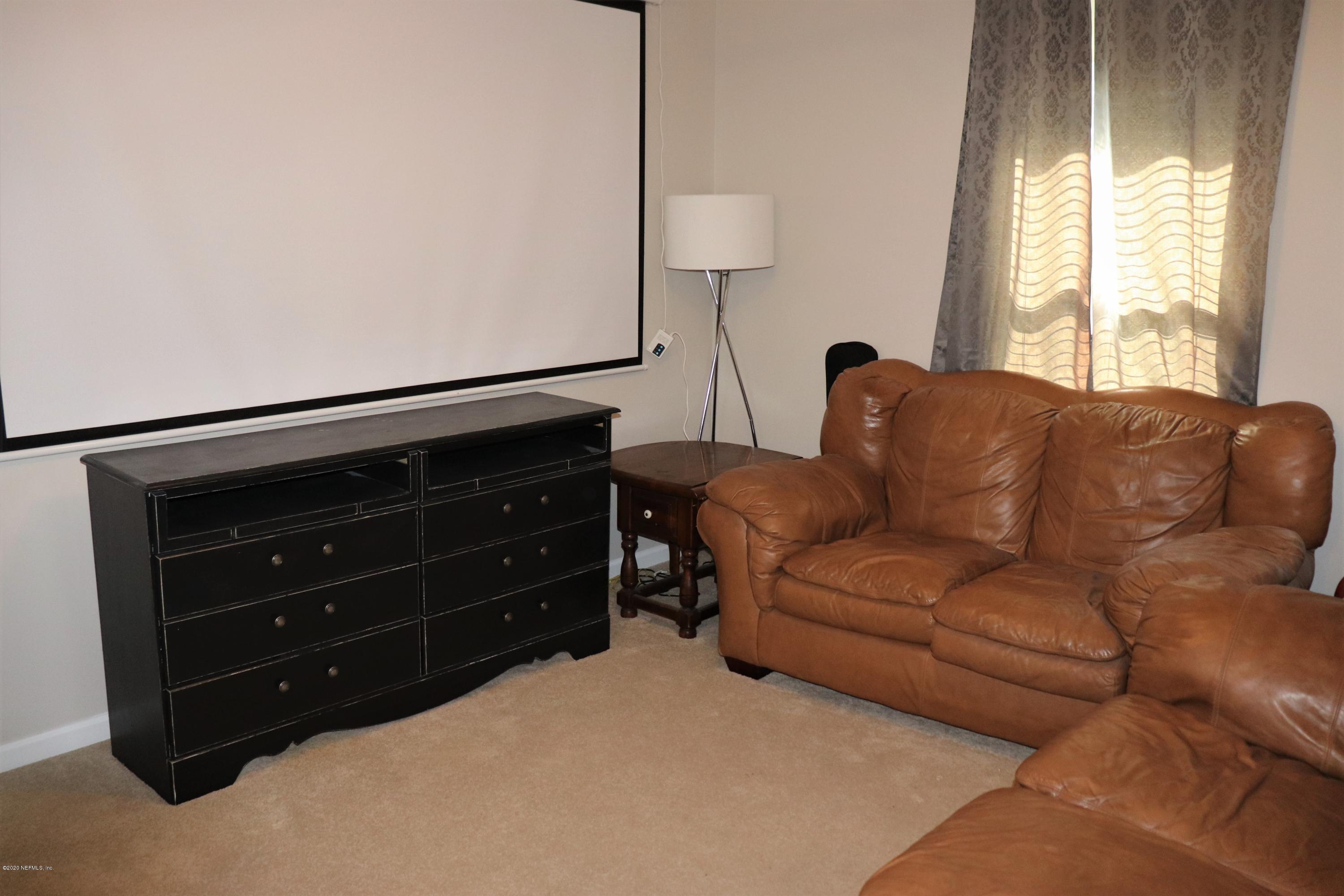 12294 Rouen Cove Drive Jacksonville, FL 32226 - Photo 36 of 41 a living room with furniture