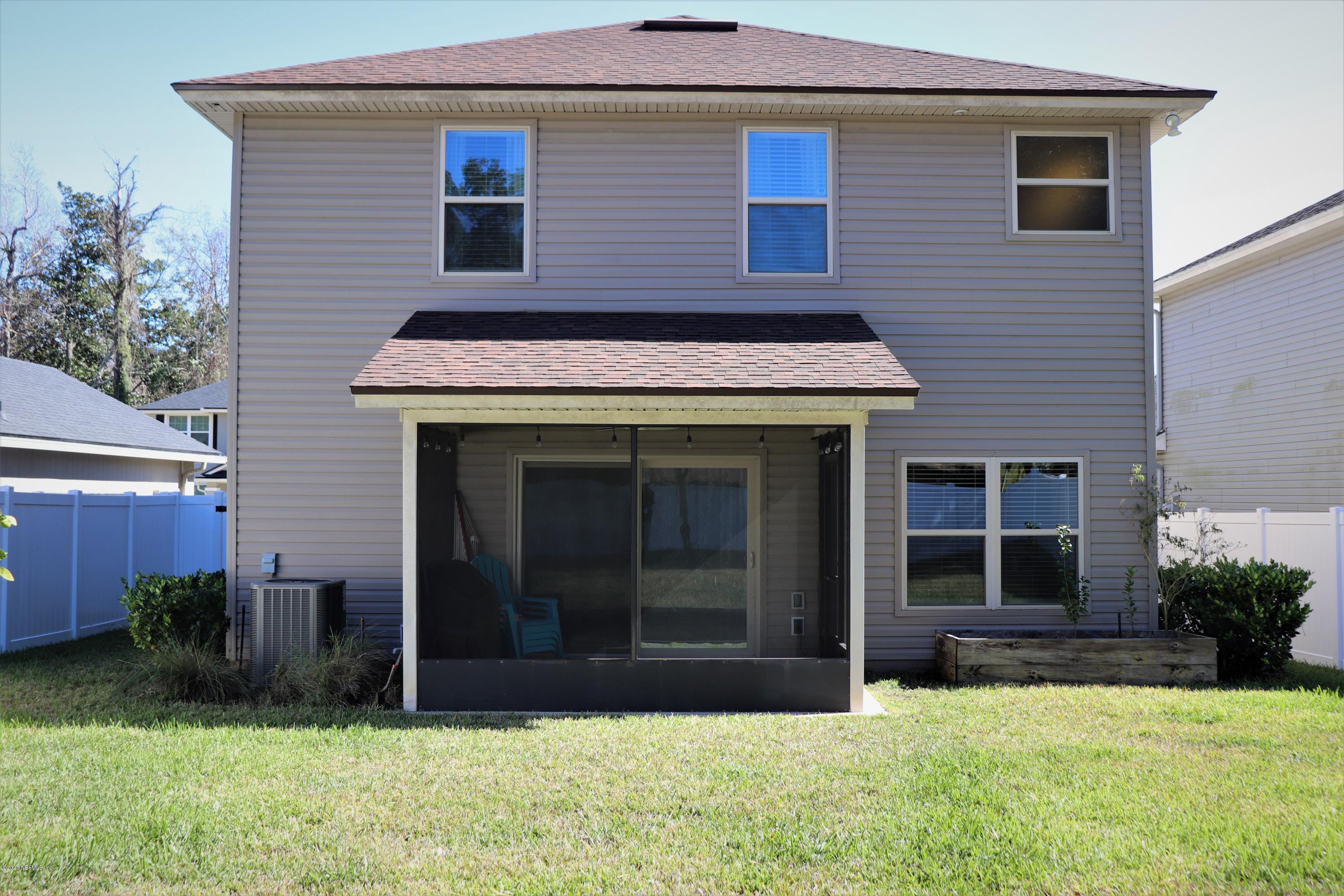 12294 Rouen Cove Drive Jacksonville, FL 32226 - Photo 38 of 41 a front view of a house with a yard