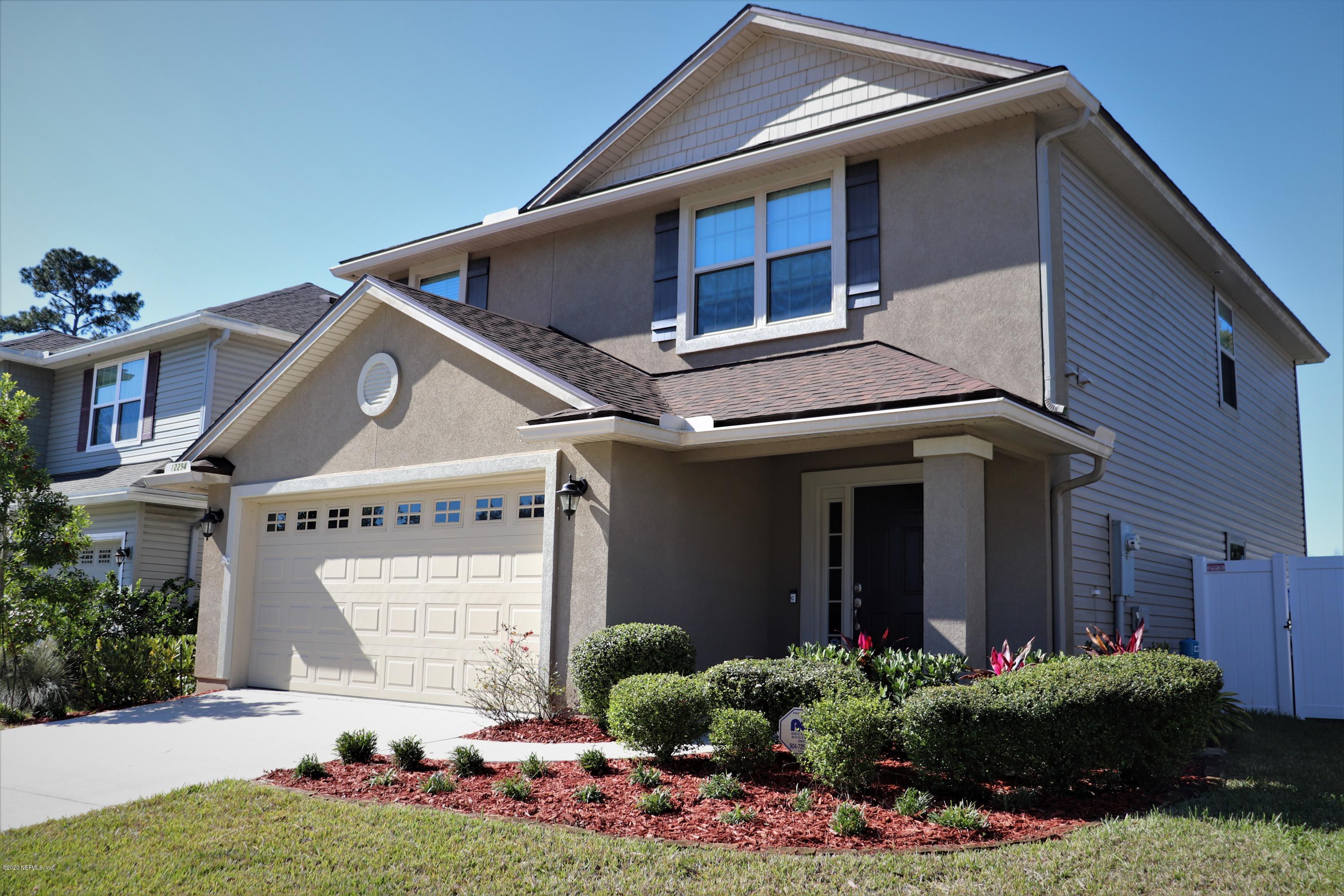 12294 Rouen Cove Drive Jacksonville, FL 32226 - Photo 9 of 41 a front view of a house with a yard