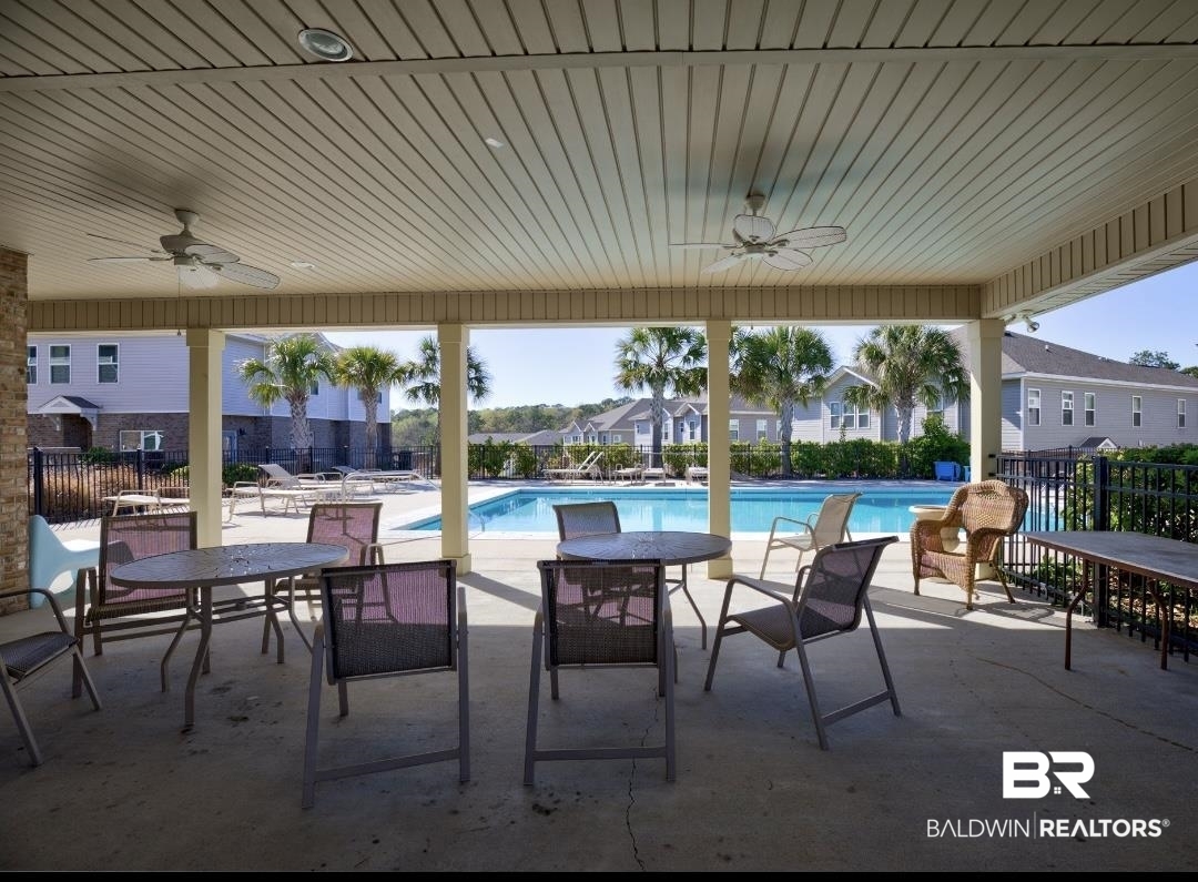6867 Spaniel Drive, Unit B Daphne, AL 36527 - Photo 31 of 36 View of patio featuring ceiling fan and a community pool