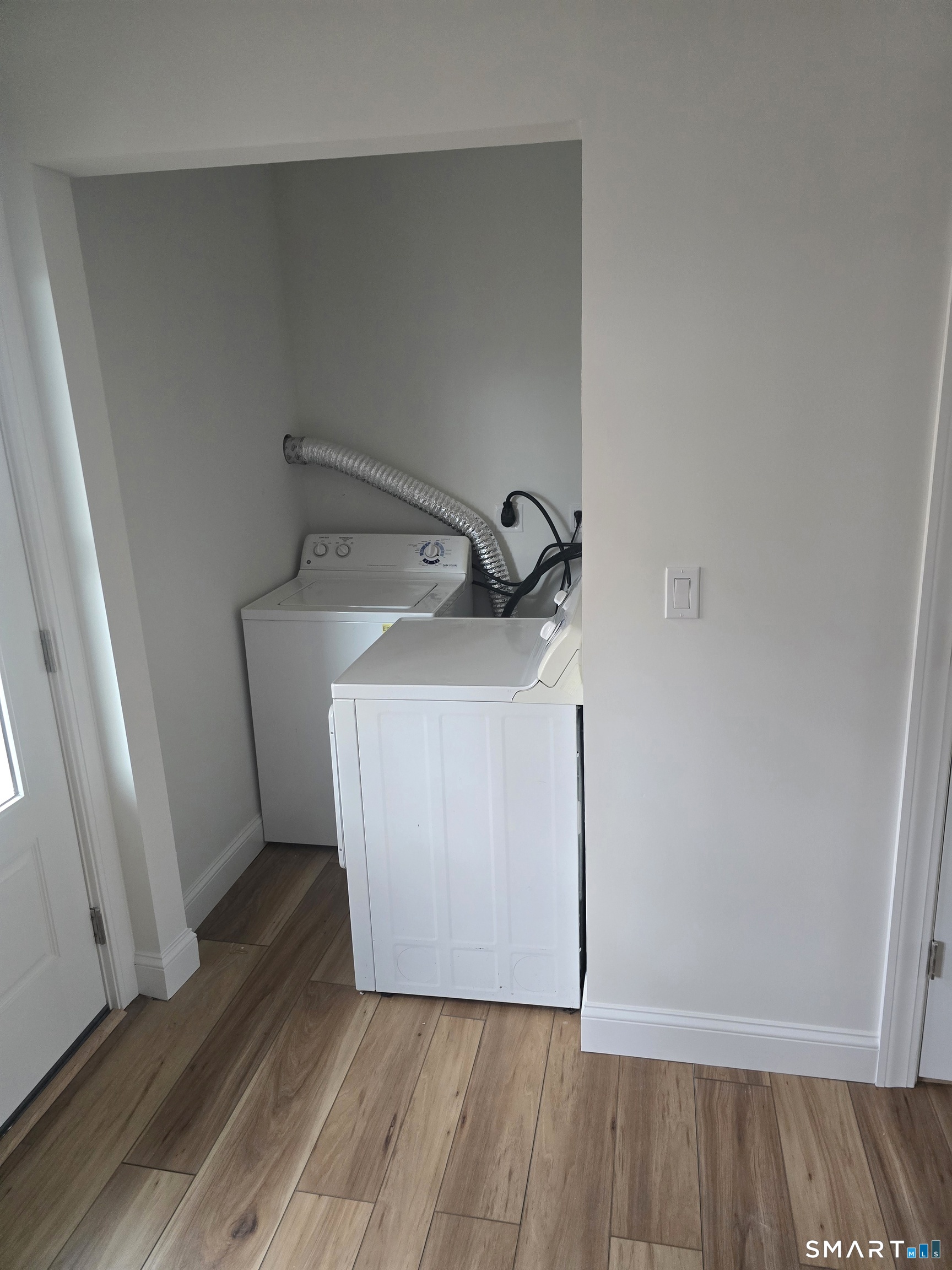 530 Jane Street, Unit 2 Bridgeport, CT 06608 - Photo 5 of 9 a utility room with wooden floor washer and dryer