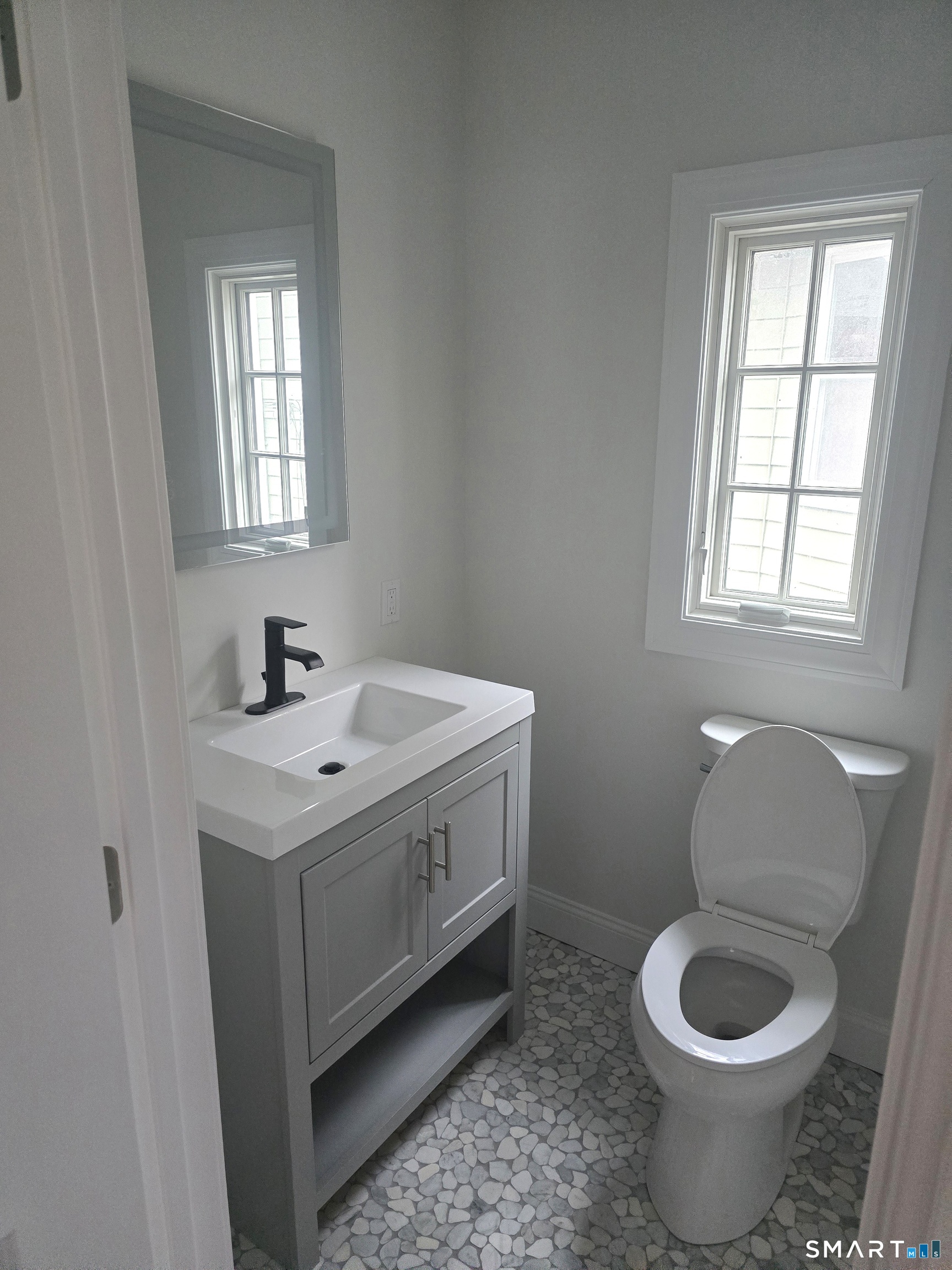 530 Jane Street, Unit 2 Bridgeport, CT 06608 - Photo 6 of 9 a bathroom with a sink toilet and window