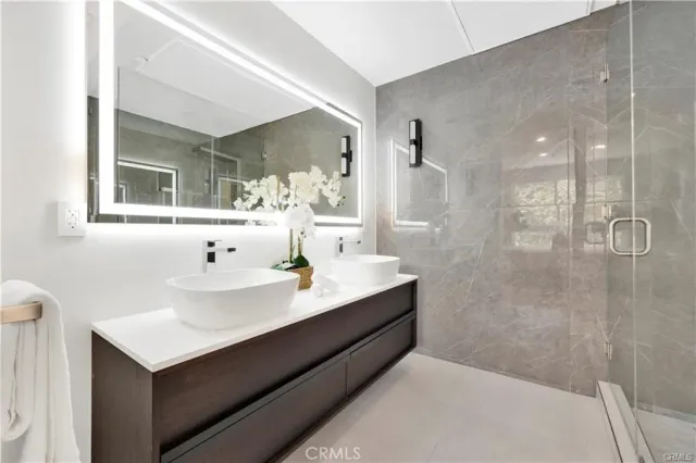 a bathroom with a sink and mirror