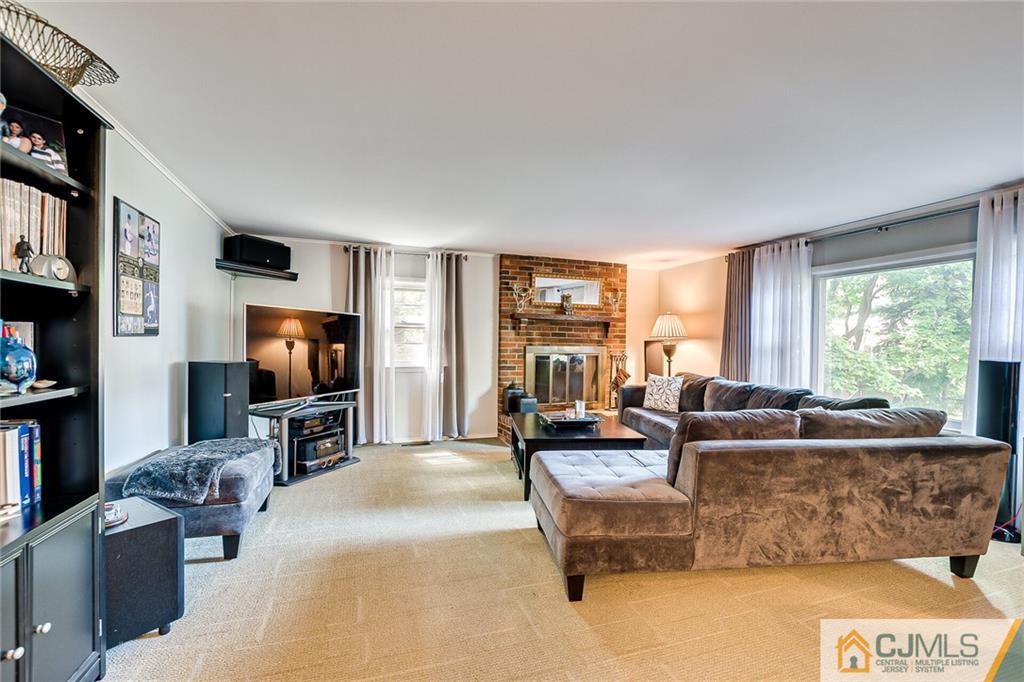 72 Monroe Avenue Edison, NJ 08820 - Photo 14 of 35 a living room with furniture and a flat screen tv