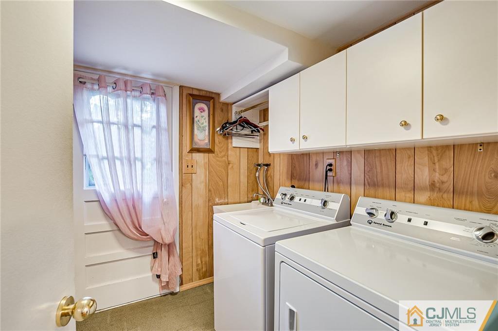 72 Monroe Avenue Edison, NJ 08820 - Photo 18 of 35 a utility room with dryer and washer