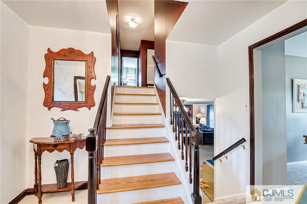 72 Monroe Avenue Edison, NJ 08820 - Photo 19 of 35 a view of entryway with wooden floor and stairs