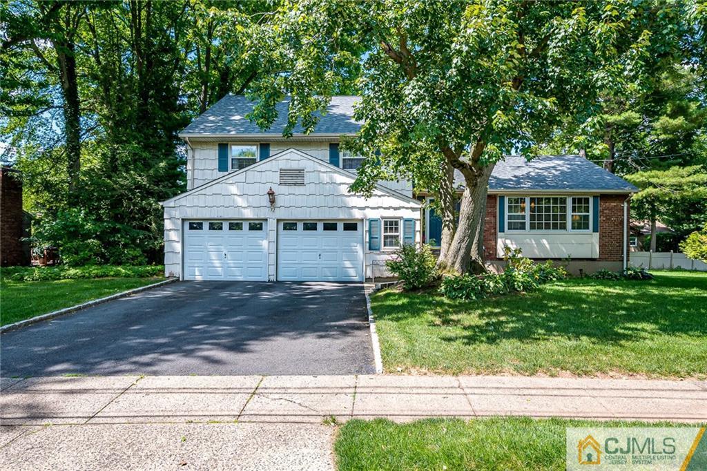 72 Monroe Avenue Edison, NJ 08820 - Photo 2 of 35 a front view of a house with a garden
