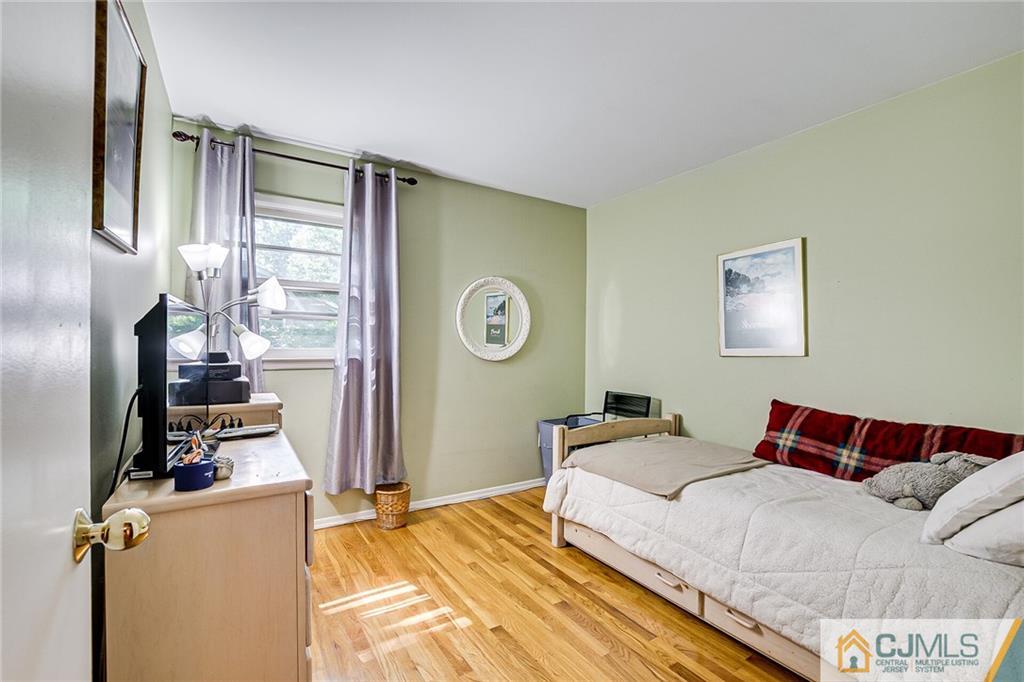 72 Monroe Avenue Edison, NJ 08820 - Photo 23 of 35 a bedroom with bed and a window