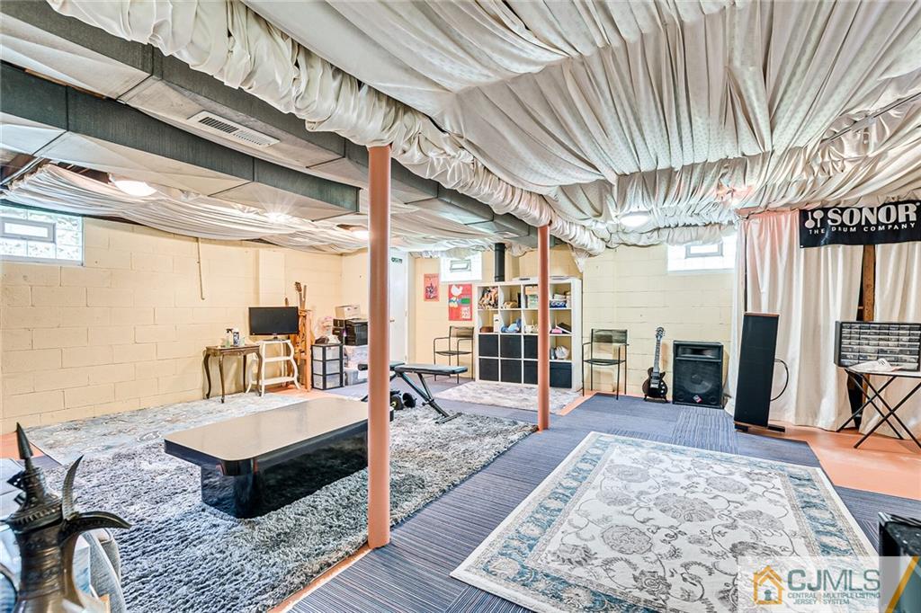 72 Monroe Avenue Edison, NJ 08820 - Photo 27 of 35 a living room with furniture and wooden floor