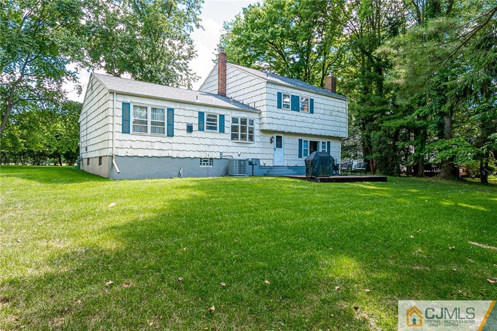 72 Monroe Avenue Edison, NJ 08820 - Photo 30 of 35 a front view of house with yard and green space