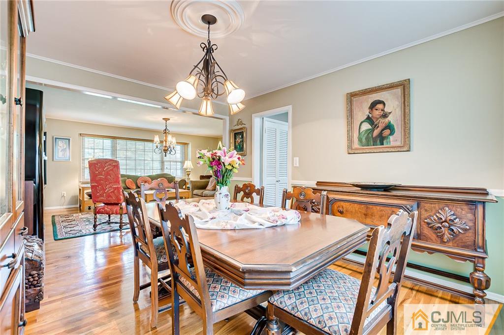 72 Monroe Avenue Edison, NJ 08820 - Photo 10 of 35 a view of a dining room with furniture window and wooden floor