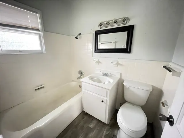 a bathroom with a toilet sink and bathtub