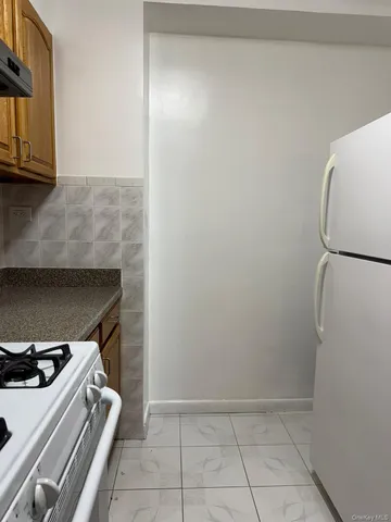 a view of storage and utility room with washer and dryer
