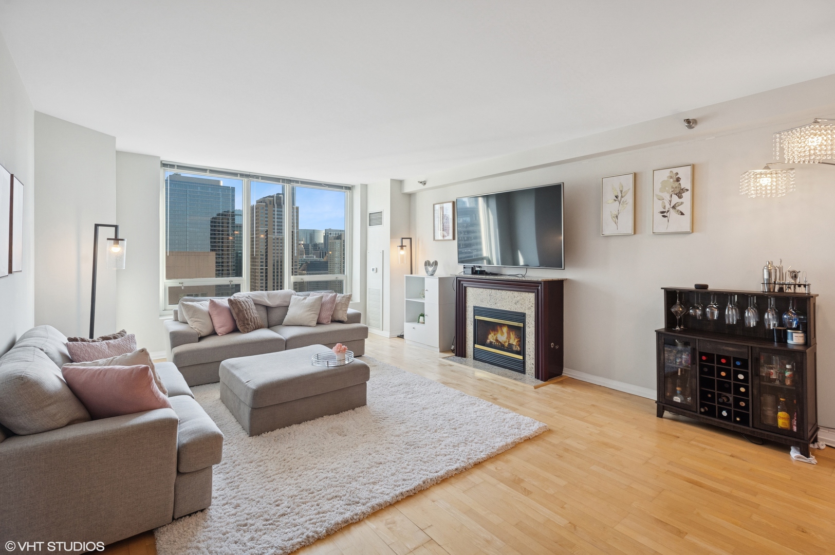 33 West Ontario Street, Unit 40D Chicago, IL 60654 - Photo 2 of 40 a living room with furniture and a fireplace