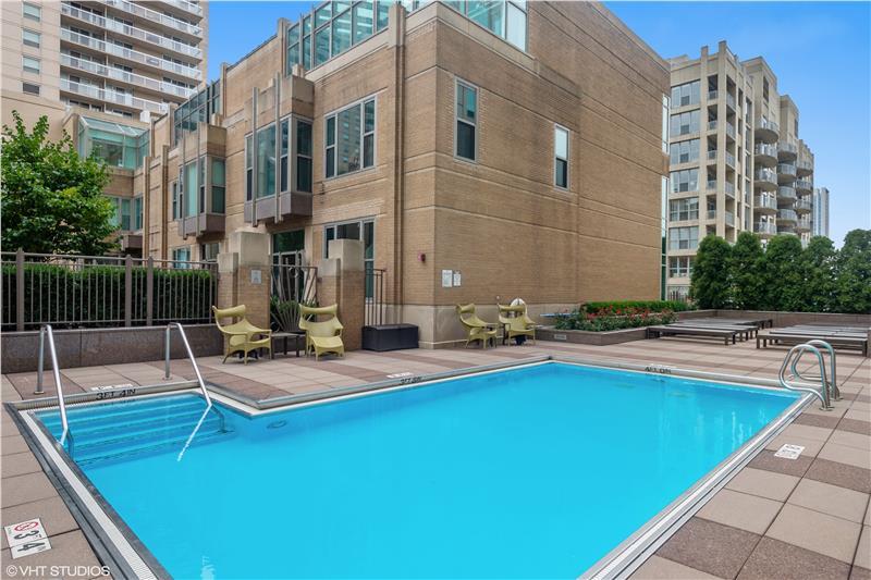 33 West Ontario Street, Unit 40D Chicago, IL 60654 - Photo 27 of 40 a view of swimming pool with outdoor seating and city view