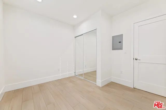 an empty room with wooden floor