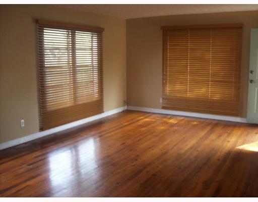 3539 Austin Street Corpus Christi, TX 78411 - Photo 2 of 4 a view of an empty room with wooden floor and a window