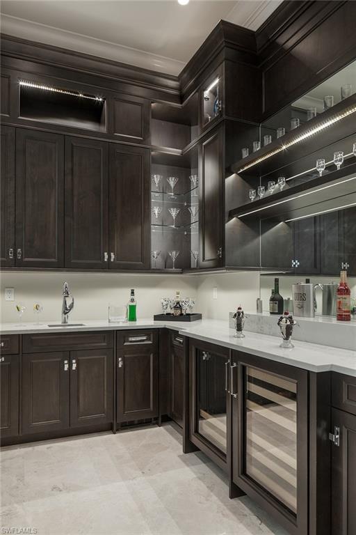 4493 Wayside Drive Naples, FL 34119 - Photo 13 of 24 a kitchen with lots of counter space and a sink