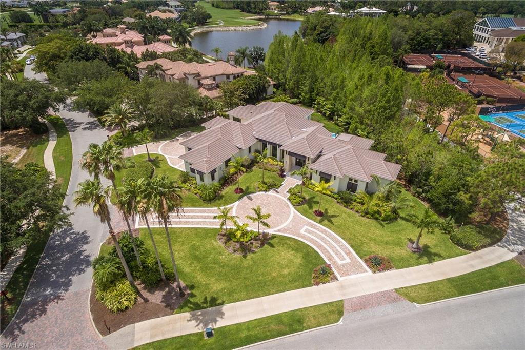 4493 Wayside Drive Naples, FL 34119 - Photo 23 of 24 an aerial view of a house with a yard and lake