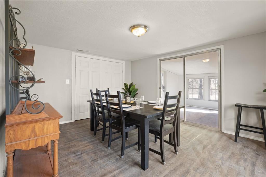 100 Sands Drive Azle, TX 76020 - Photo 17 of 31 a view of a dining room with furniture and wooden floor