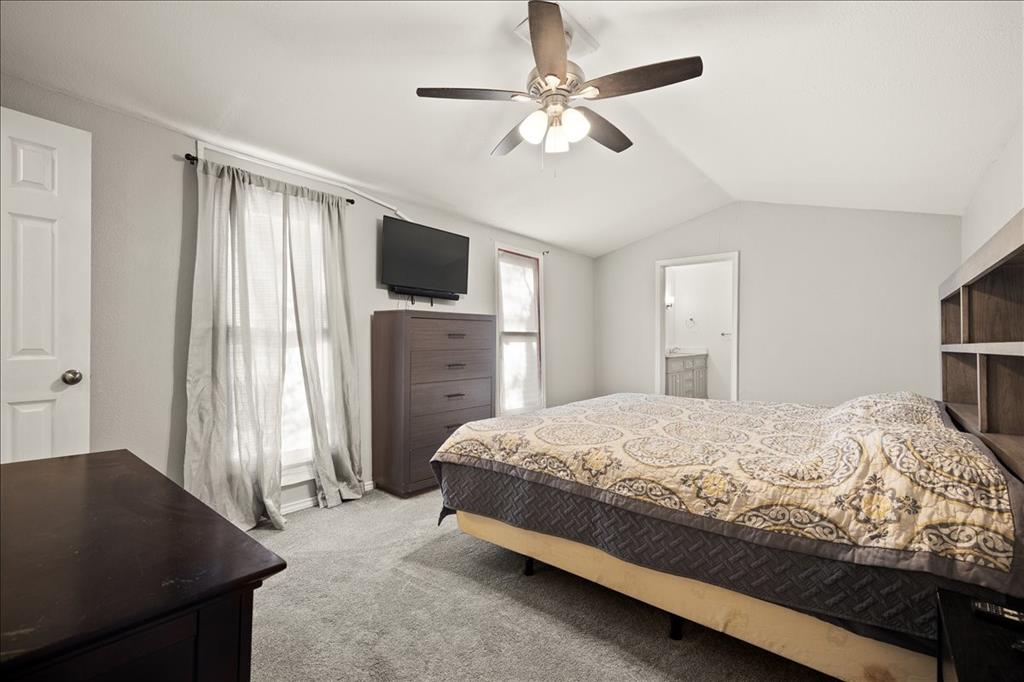 100 Sands Drive Azle, TX 76020 - Photo 23 of 31 a bedroom with a bed and a television