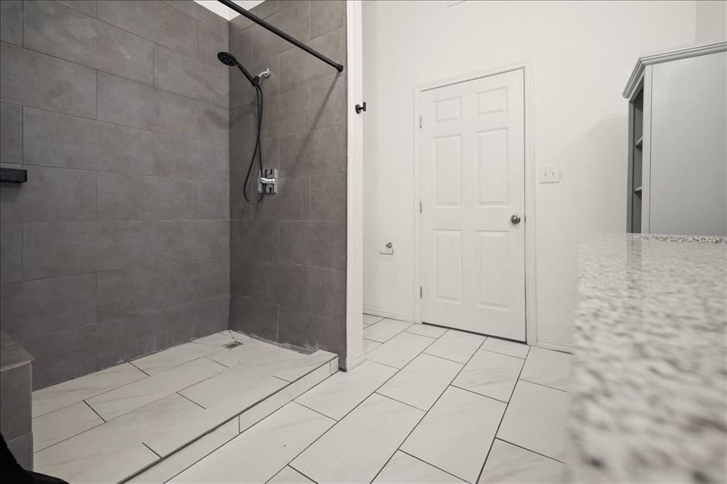 100 Sands Drive Azle, TX 76020 - Photo 26 of 31 a bathroom with a shower and a sink