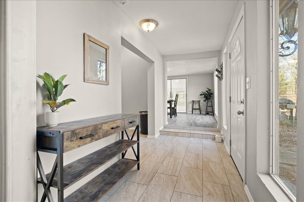 100 Sands Drive Azle, TX 76020 - Photo 27 of 31 a view of a hallway view with wooden floor and staircase