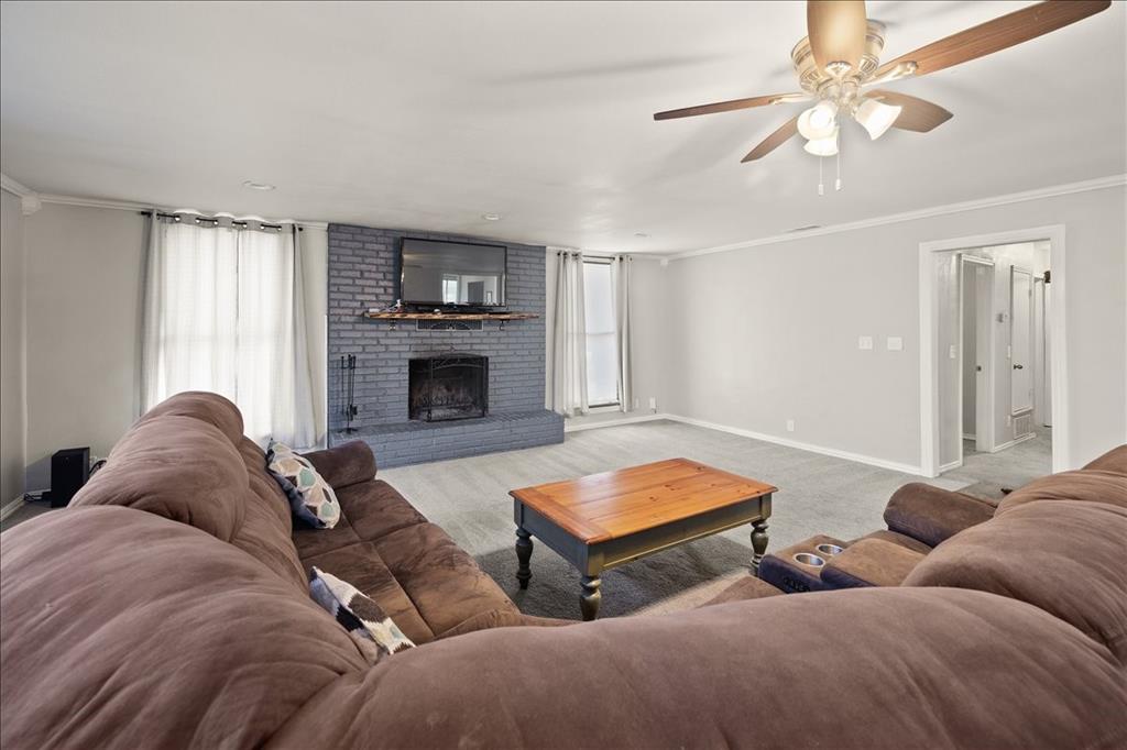 100 Sands Drive Azle, TX 76020 - Photo 29 of 31 a living room with furniture and a fireplace
