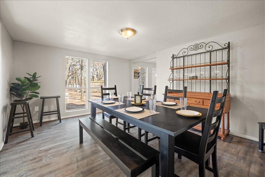 100 Sands Drive Azle, TX 76020 - Photo 30 of 31 a view of a dining room with furniture and wooden floor