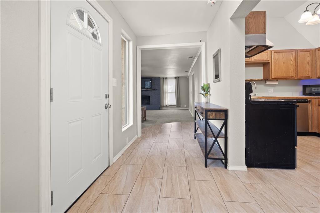 100 Sands Drive Azle, TX 76020 - Photo 9 of 31 a view of a kitchen from the hallway