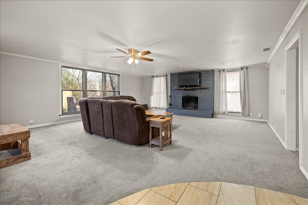 100 Sands Drive Azle, TX 76020 - Photo 10 of 31 a living room with furniture and a fireplace
