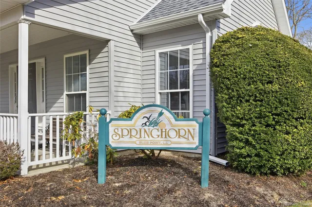 a sign that is on the side of the house