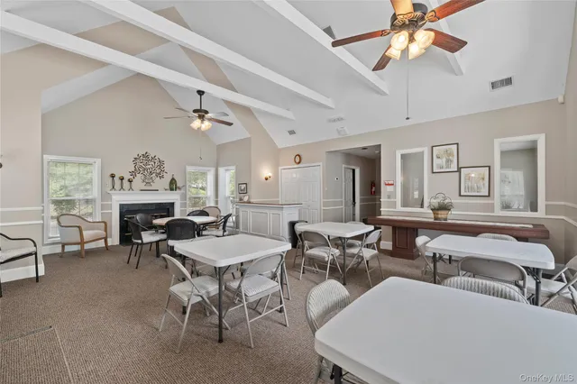 a view of a livingroom with furniture window and wooden floor
