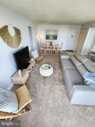 a living room with furniture and a chair