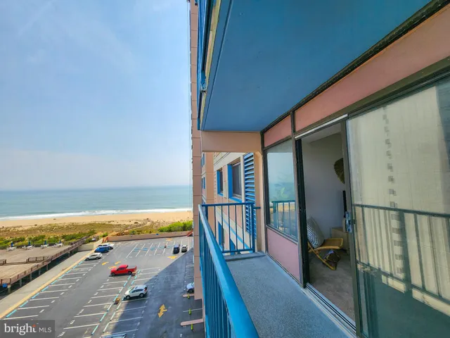 a view of a balcony with wooden floor