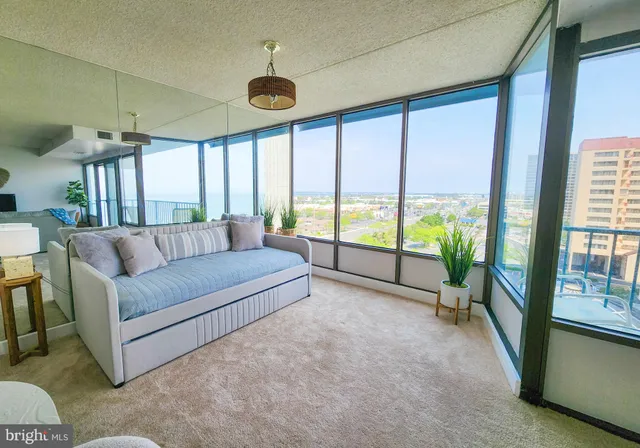 a living room with furniture and a large window