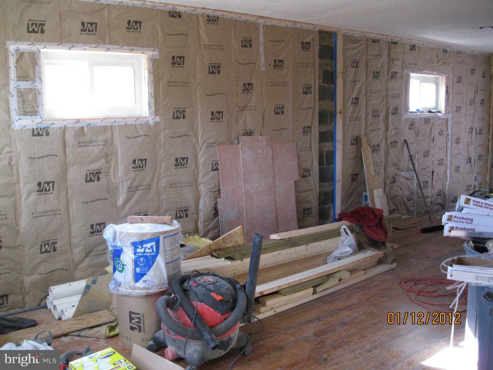 1680 Poles Road Essex, MD 21221 - Photo 14 of 15 a living room with furniture and a rug