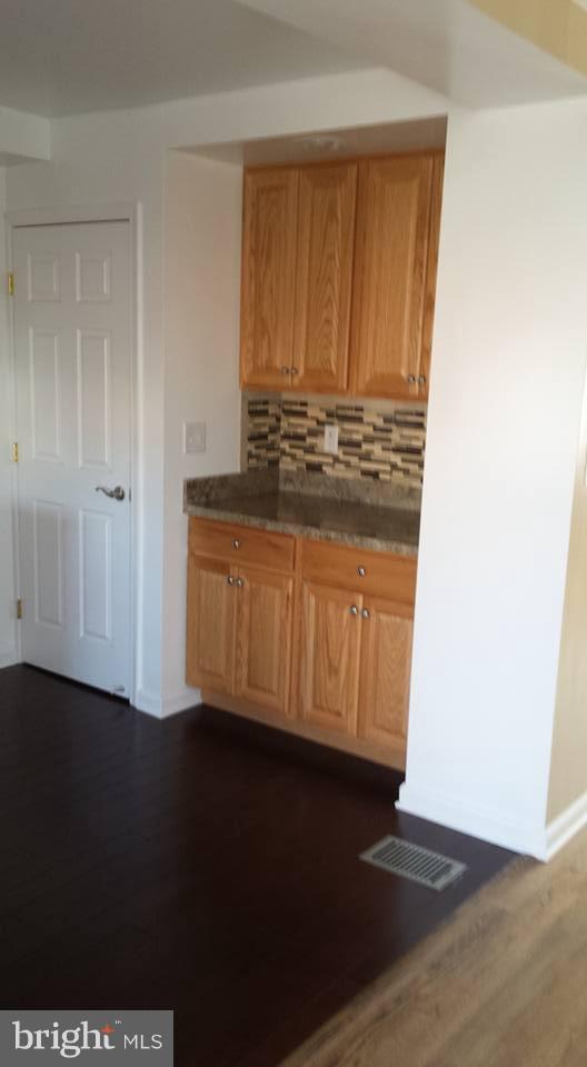 1680 Poles Road Essex, MD 21221 - Photo 3 of 15 a view of kitchen with wooden floor
