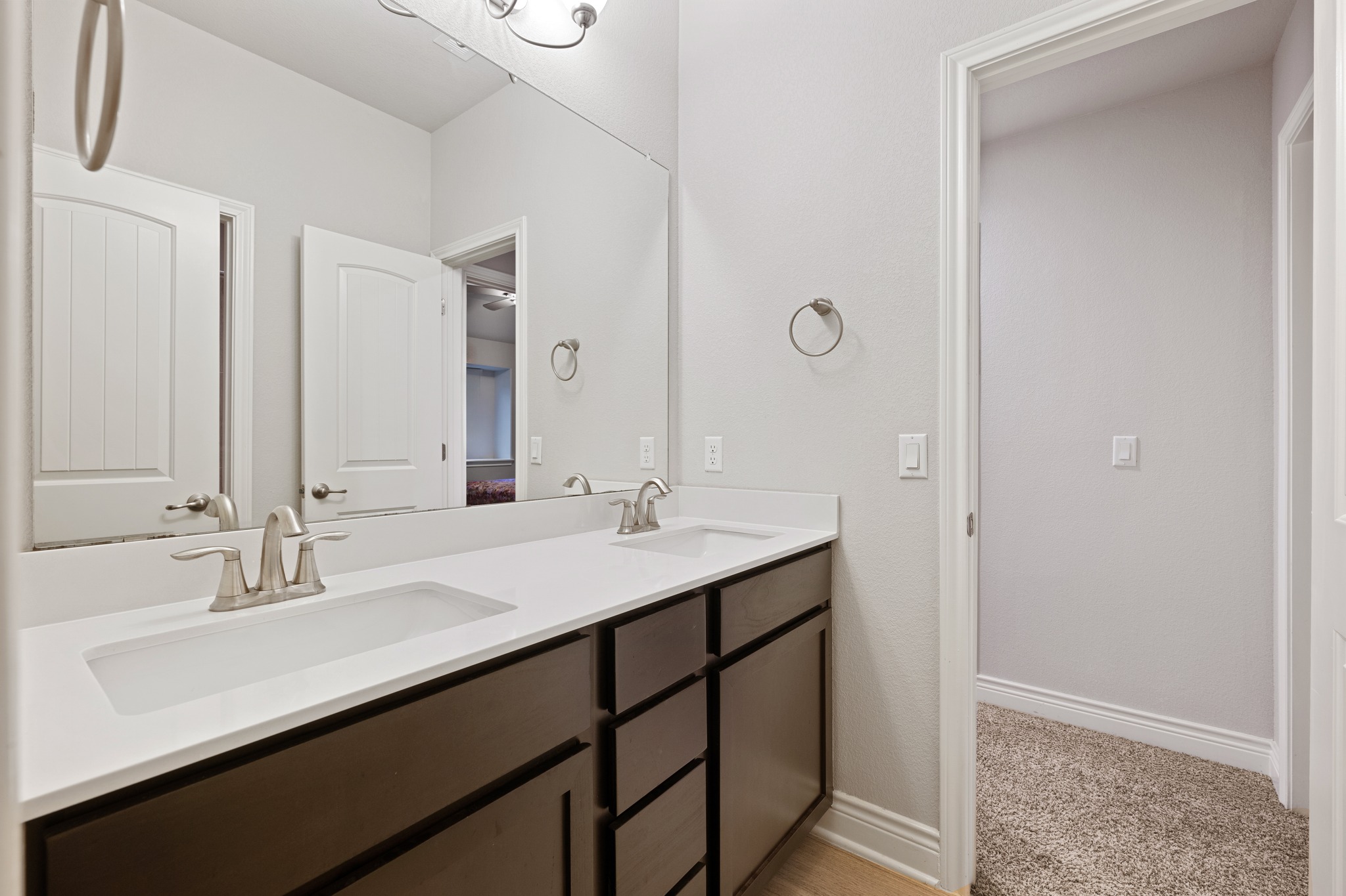 6405 Alleyton Drive Austin, TX 78721 - Photo 16 of 30 a bathroom with a sink double vanity and a mirror