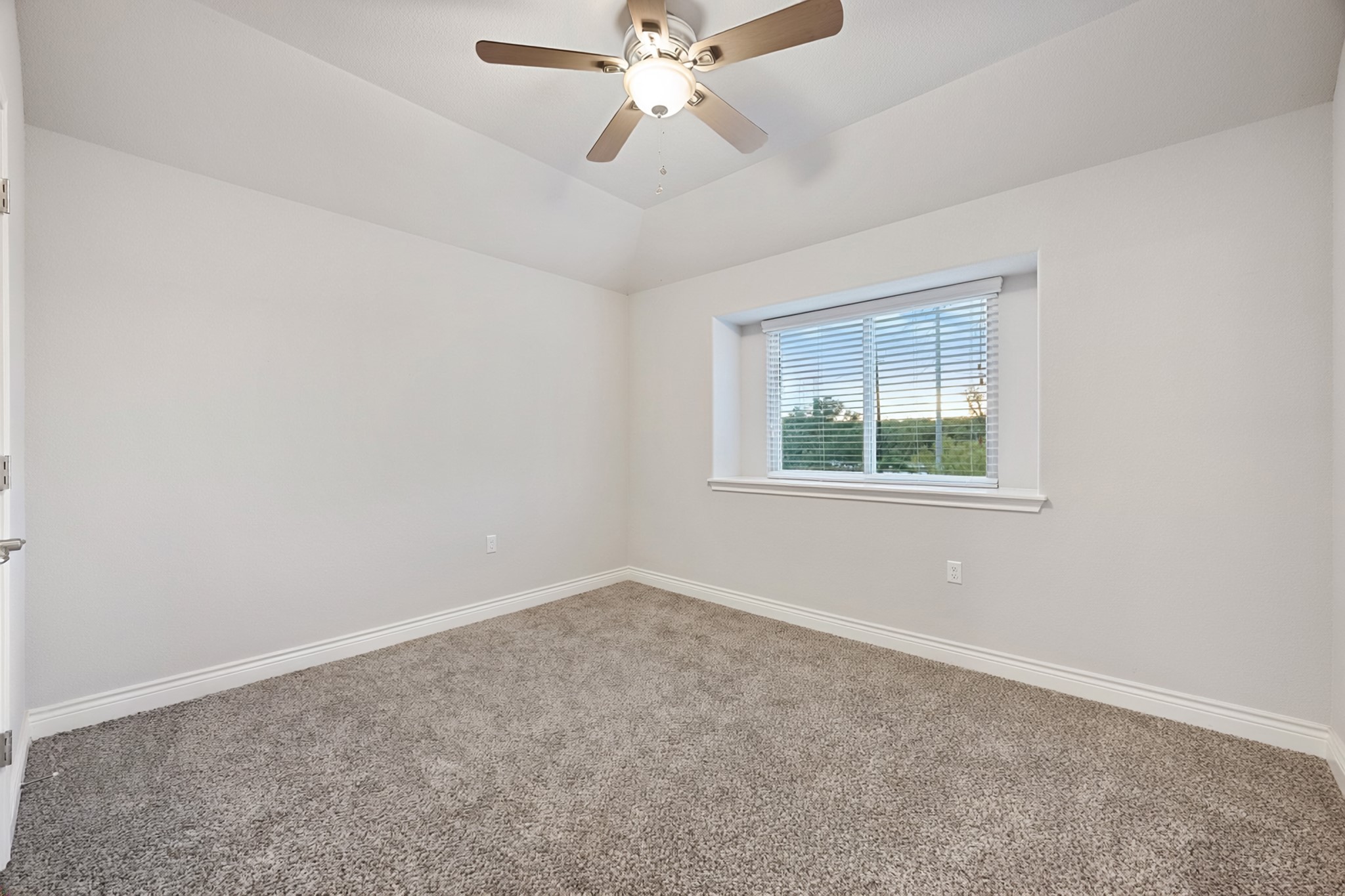 6405 Alleyton Drive Austin, TX 78721 - Photo 17 of 30 an empty room with a window and a fan