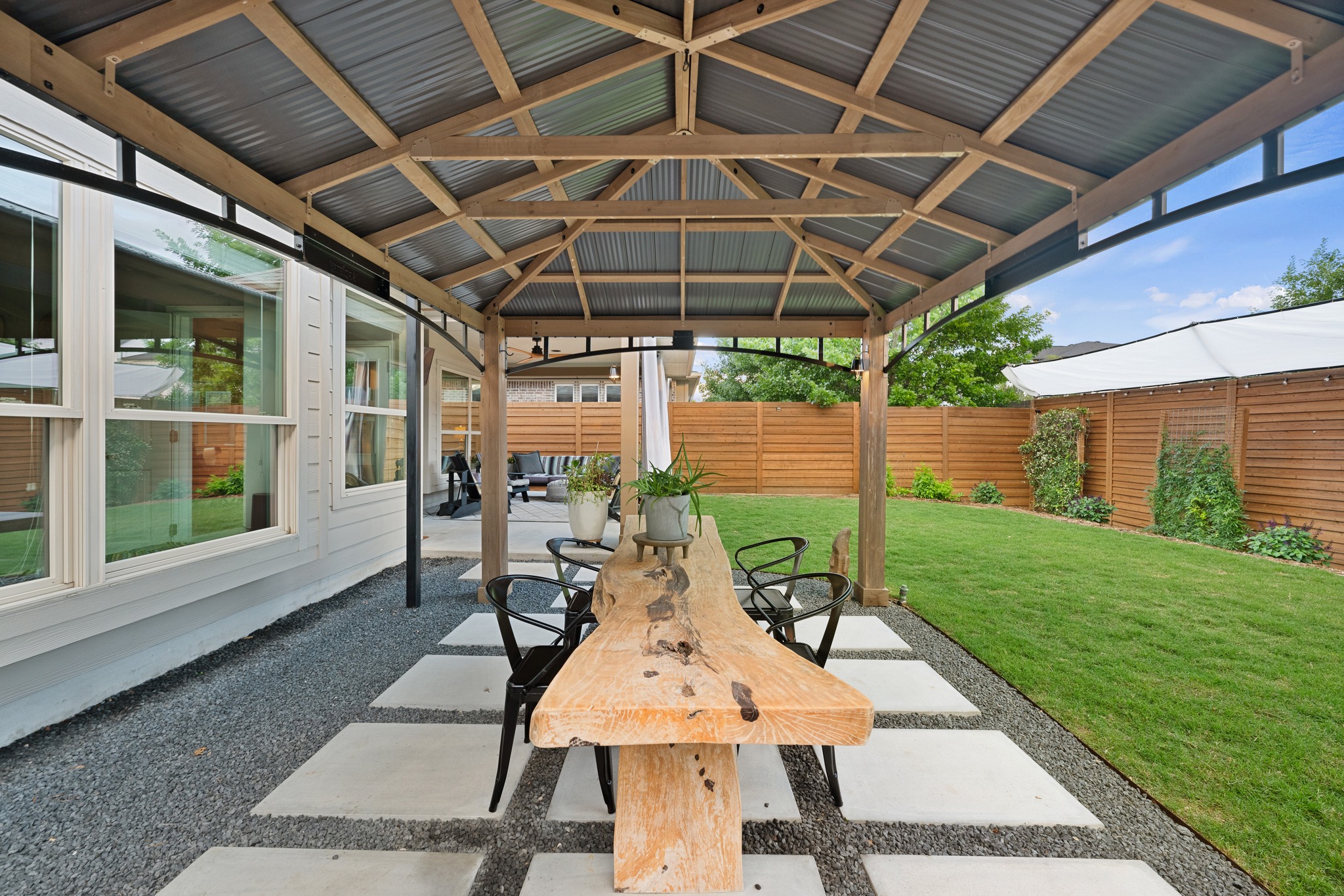 6405 Alleyton Drive Austin, TX 78721 - Photo 21 of 30 a view of a patio with a table and chairs